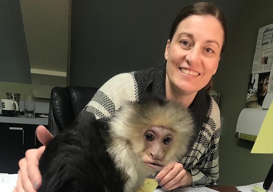 Angela Lett with a capuchin monkey