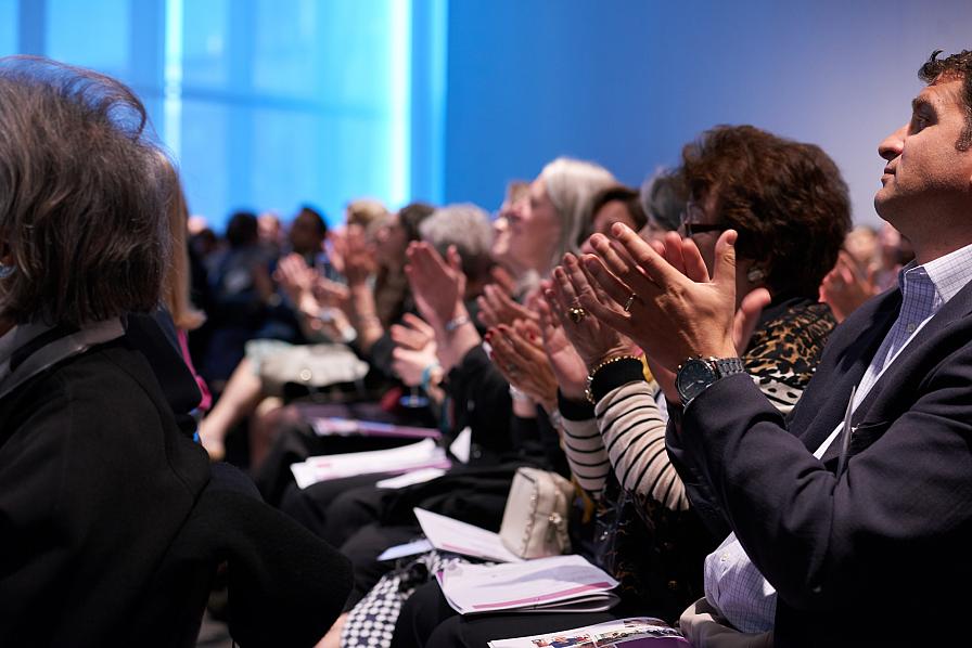 audience clapping at showcase